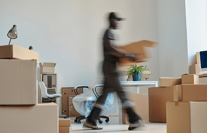 man carrying box