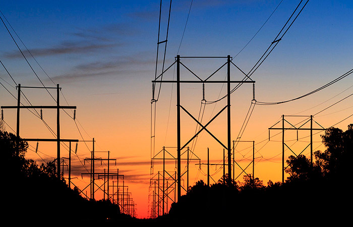 Sunrise over powerlines