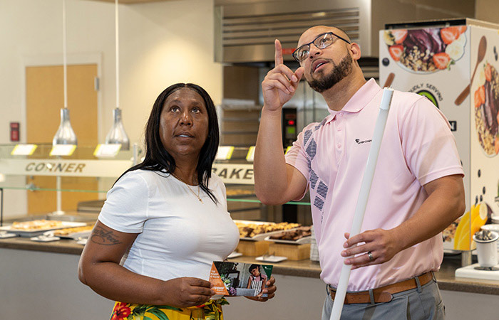 Woman and man discussing ways to save energy at business