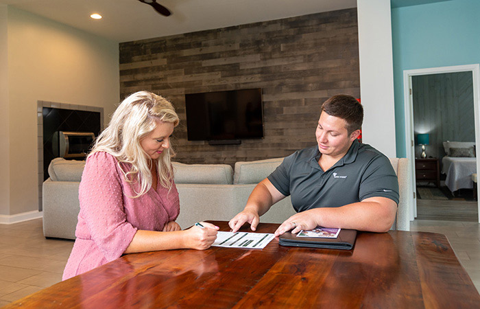 Santee Cooper employee going over loan options with consumer