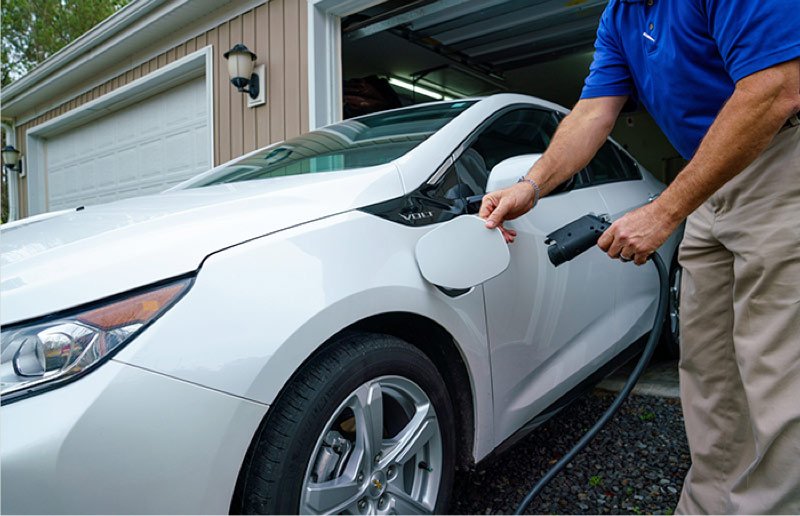 Man charging EV