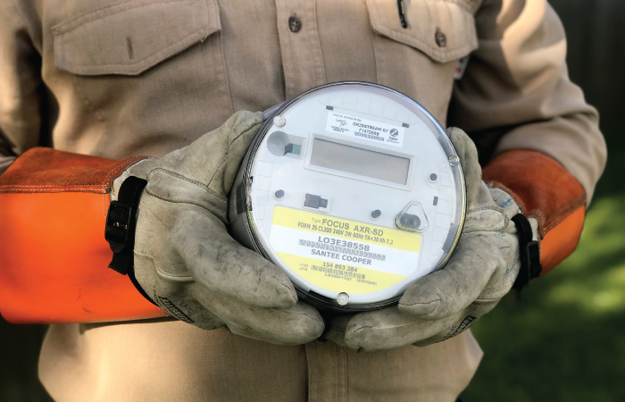 Meter Held in Gloved Hands