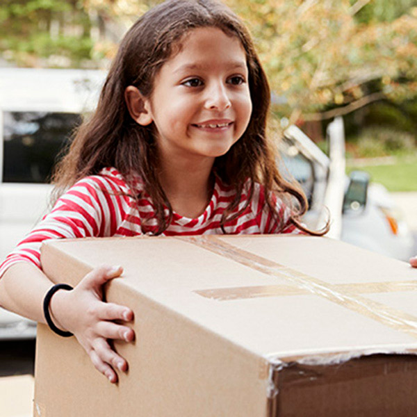 young girl holding box