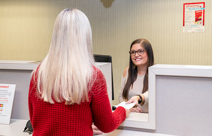 Woman paying bill at office