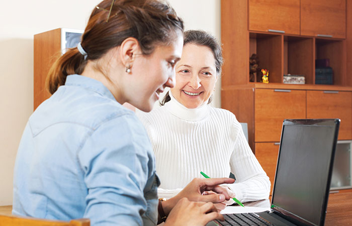 Two women working on budgets