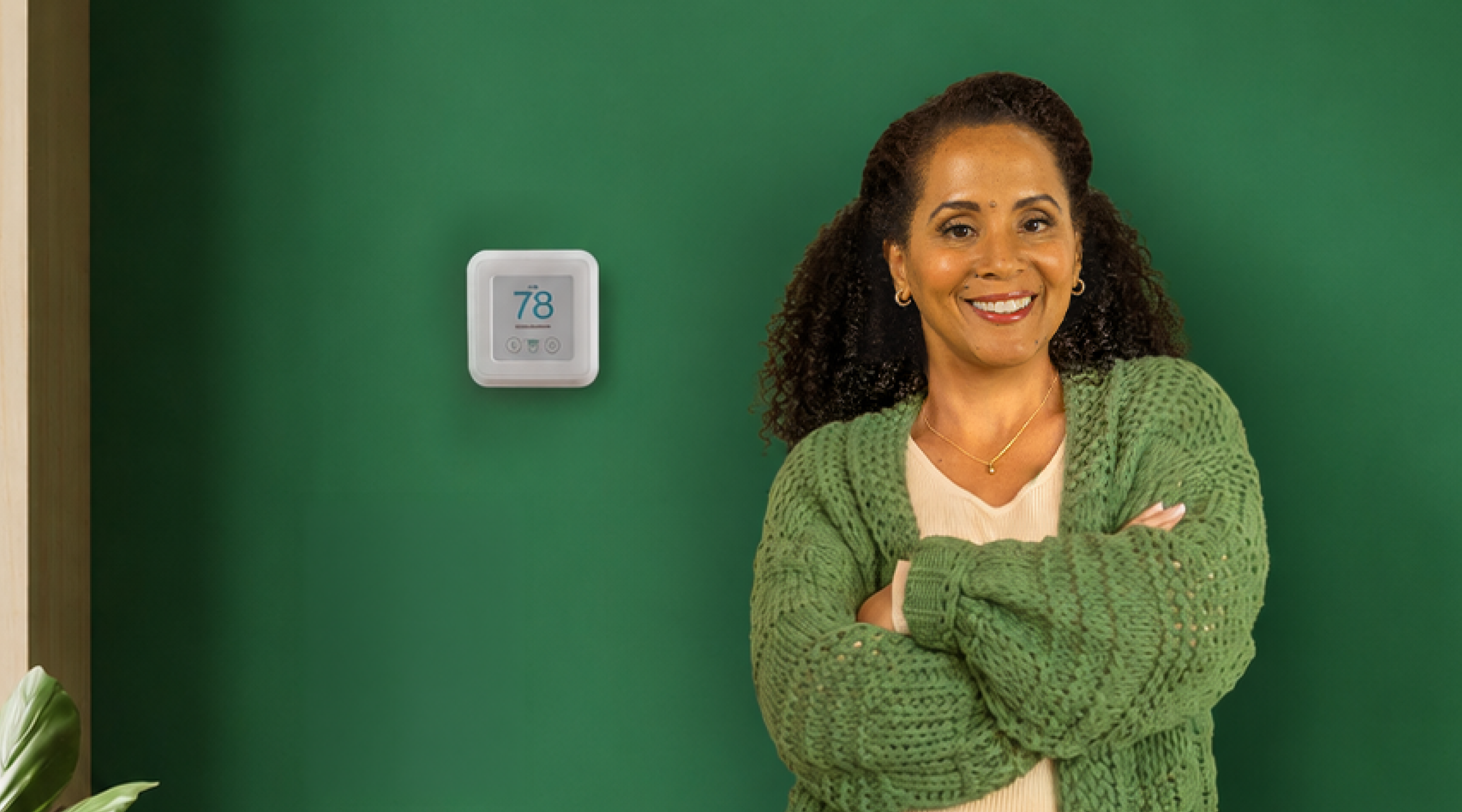 woman standing near thermostat