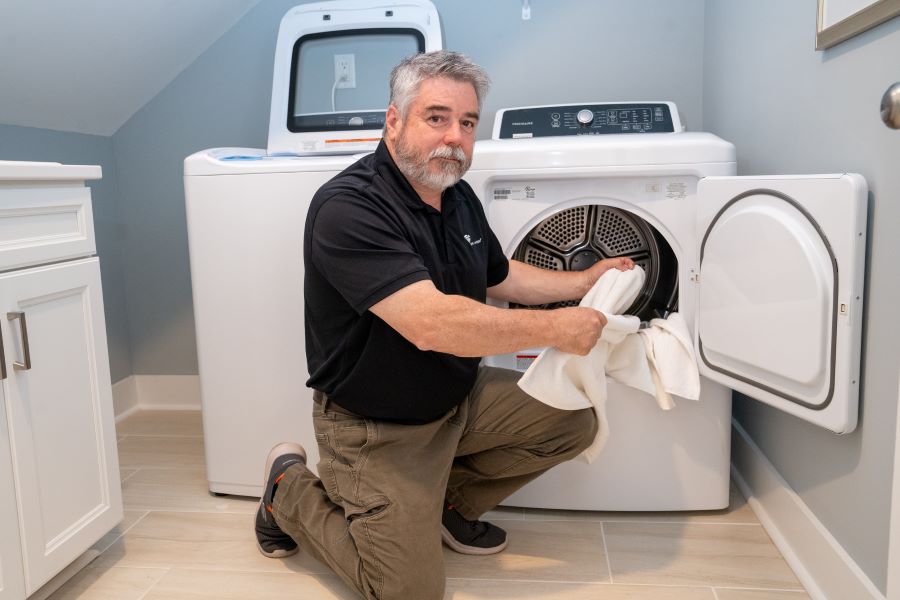 Man doing laundry at non-peak time